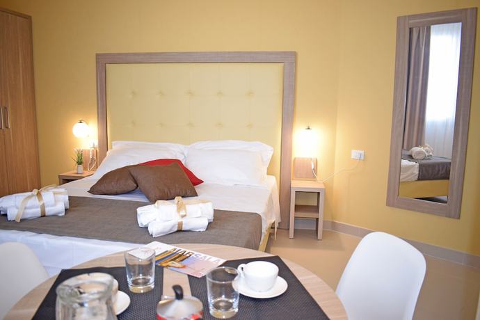 Imagen de la habitación del Hotel Travini Residence. Foto 17