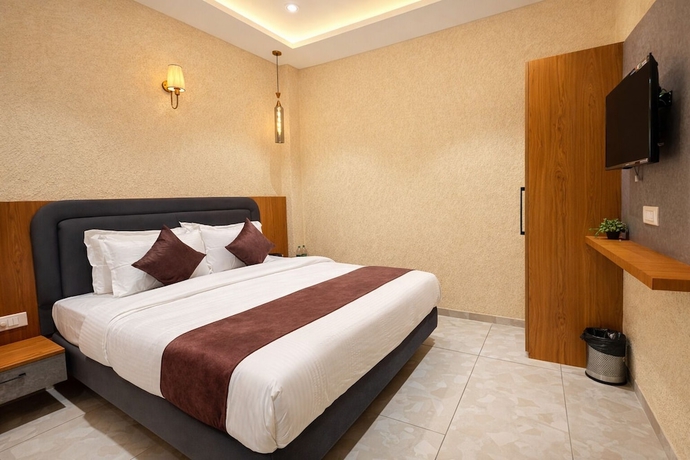 Imagen de la habitación del Hotel Travinities Premier, Ujjain. Foto 2