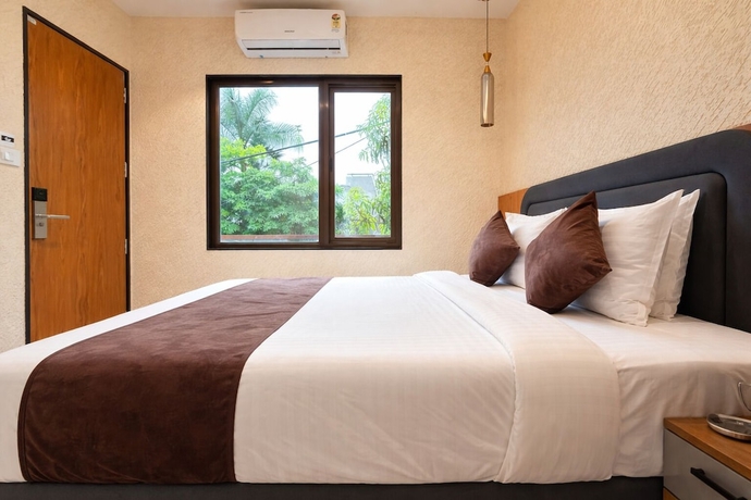 Imagen de la habitación del Hotel Travinities Premier, Ujjain. Foto 7