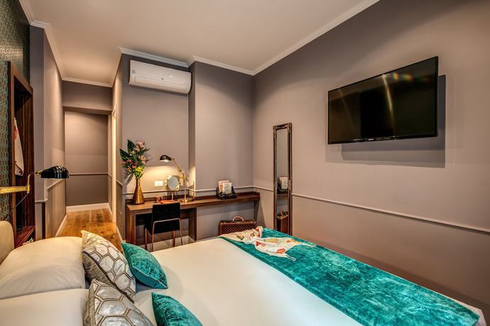 Imagen de la habitación del Hotel Tree Charme Parliament Boutique. Foto 11