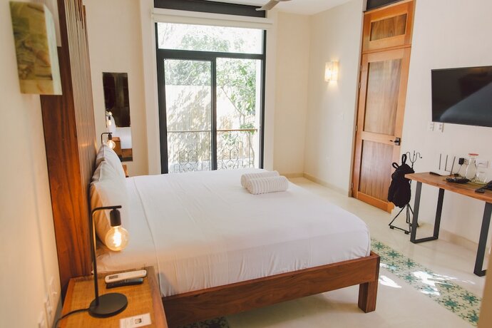 Imagen de la habitación del Hotel TreeHouse Boutique. Foto 18