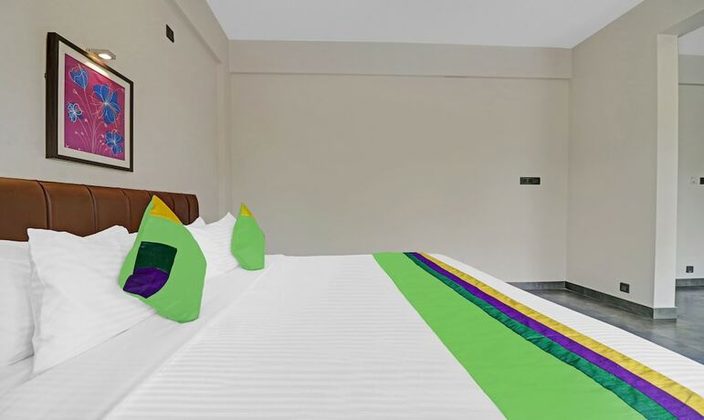 Imagen de la habitación del Hotel Treebo Grand Vistara Airport Suites. Foto 17