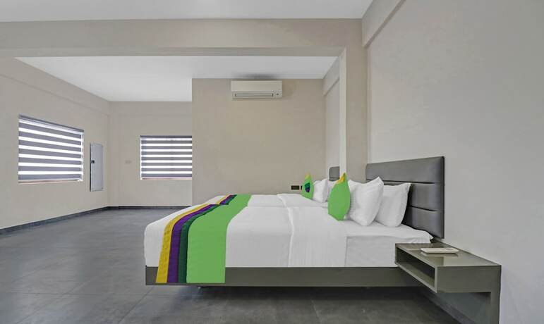Imagen de la habitación del Hotel Treebo Grand Vistara Airport Suites. Foto 19