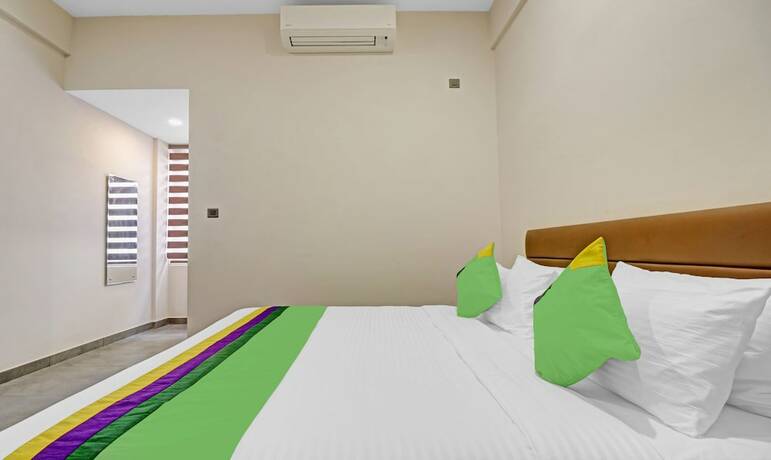 Imagen de la habitación del Hotel Treebo Grand Vistara Airport Suites. Foto 20