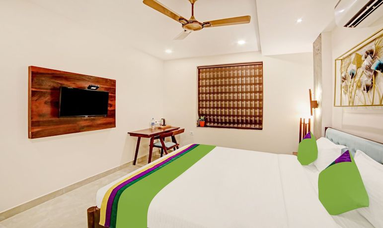 Imagen de la habitación del Hotel Treebo Lazystay Elite. Foto 11