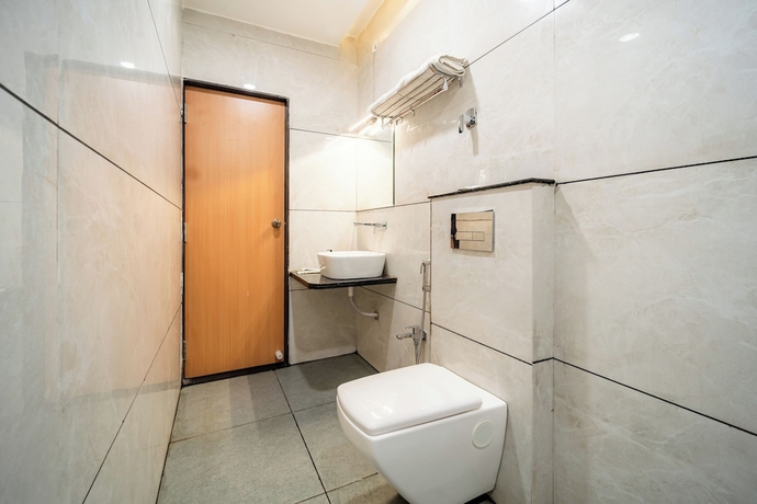 Imagen de la habitación del Hotel Treebo Lotus Blue. Foto 2