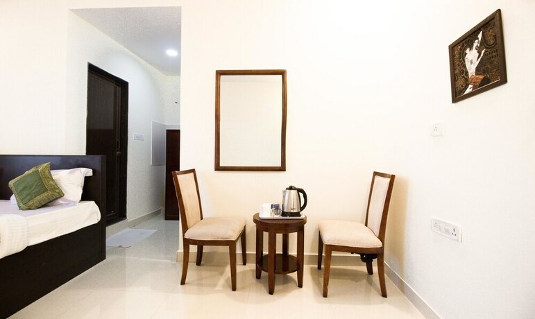 Imagen de la habitación del Hotel Treebo Midtown. Foto 17