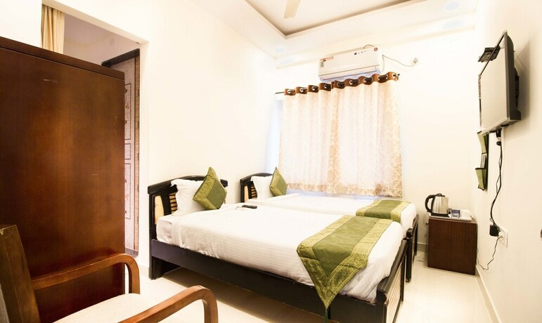 Imagen de la habitación del Hotel Treebo Midtown. Foto 19