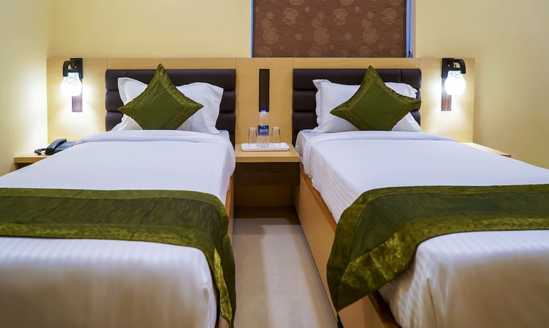 Imagen de la habitación del Hotel Treebo Oasis. Foto 6