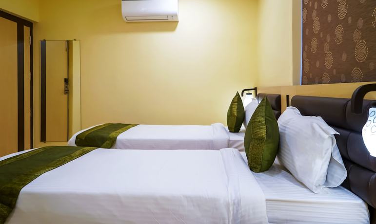 Imagen de la habitación del Hotel Treebo Oasis. Foto 13