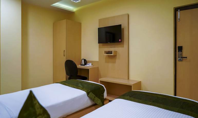 Imagen de la habitación del Hotel Treebo Oasis. Foto 15