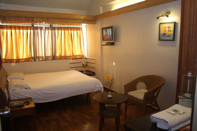 Imagen de la habitación del Hotel Treebo Sahara Shivaji Nagar. Foto 13