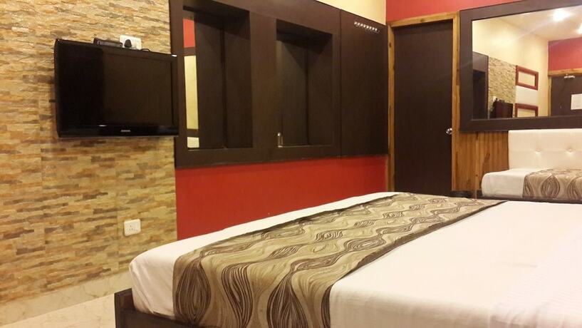 Imagen de la habitación del Hotel Treebo Select Varuna. Foto 7