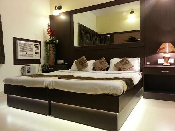 Imagen de la habitación del Hotel Treebo Select Varuna. Foto 17