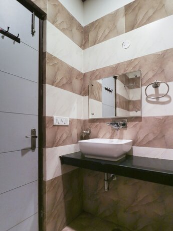 Imagen de la habitación del Hotel Treebo Seven. Foto 15