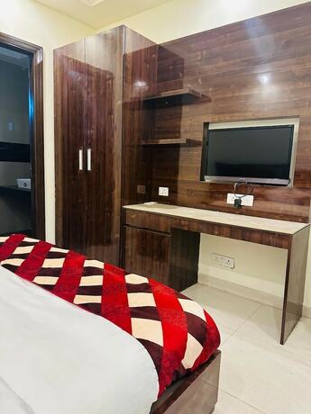 Imagen de la habitación del Hotel Treebo Sunny Feast. Foto 15