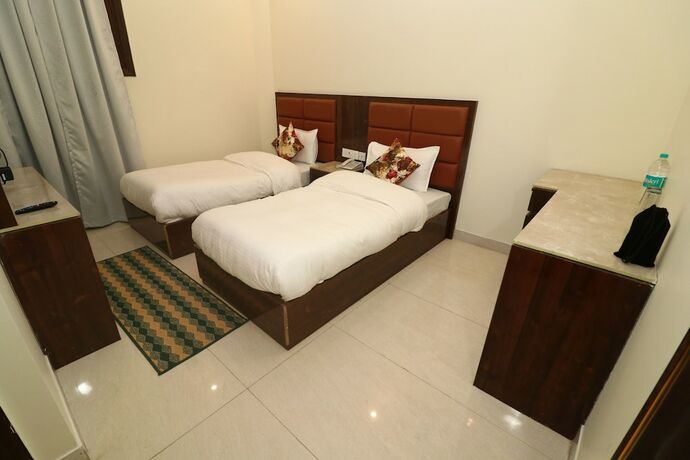 Imagen de la habitación del Hotel Treebo Sunny Feast. Foto 16