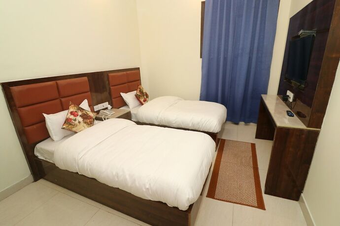 Imagen de la habitación del Hotel Treebo Sunny Feast. Foto 19