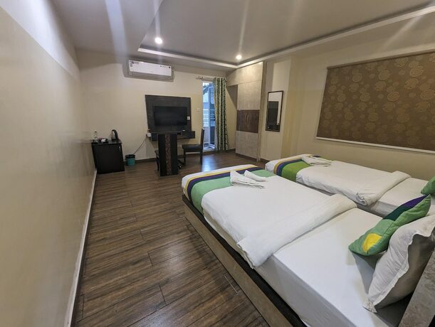 Imagen de la habitación del Hotel Treebo Trend Address Inn. Foto 21