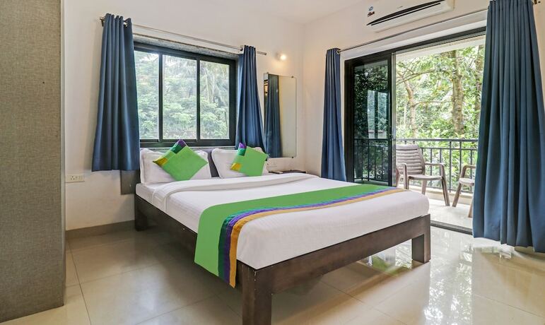 Imagen de la habitación del Hotel Treebo Trend Aquamarine Arpora. Foto 17