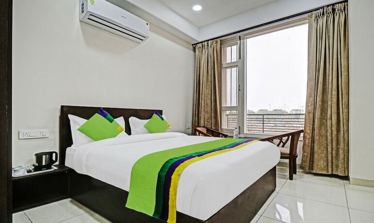 Imagen de la habitación del Hotel Treebo Trend Kamron Regency. Foto 19