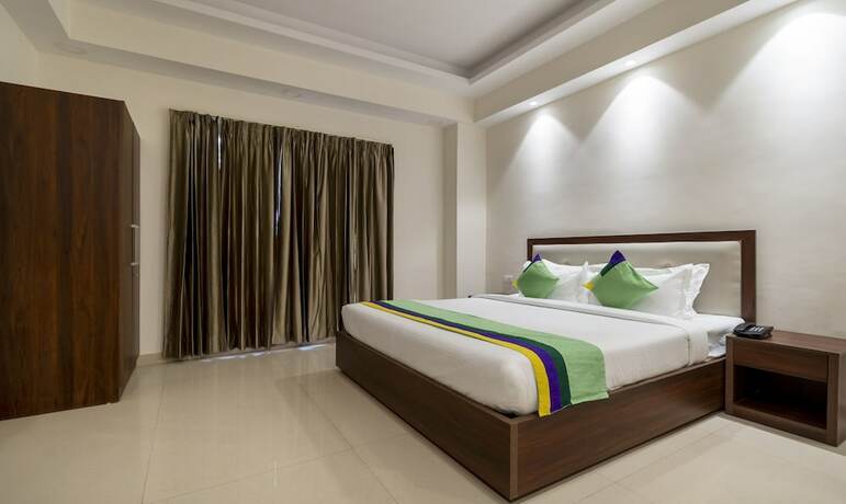 Imagen de la habitación del Hotel Treebo Trend La Mirage Suites. Foto 16