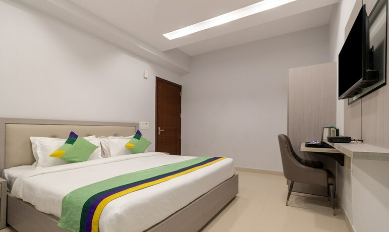 Imagen de la habitación del Hotel Treebo Trend La Mirage Suites. Foto 20
