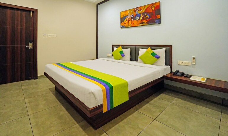 Imagen de la habitación del Hotel Treebo Trend Lazystay Grand. Foto 19
