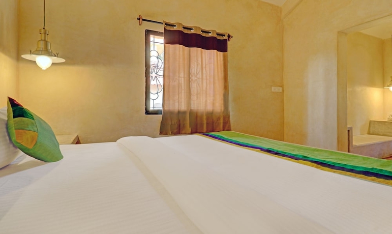 Imagen de la habitación del Hotel Treebo Trend Morjim Banyan Resort. Foto 3