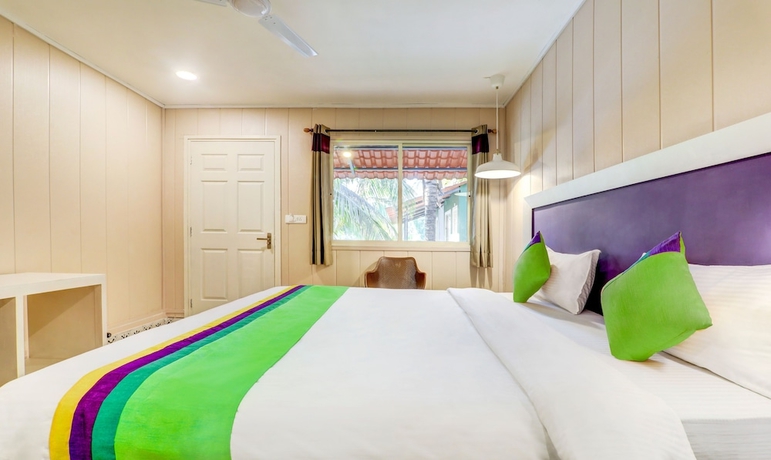 Imagen de la habitación del Hotel Treebo Trend Morjim Banyan Resort. Foto 7