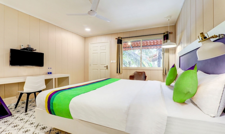 Imagen de la habitación del Hotel Treebo Trend Morjim Banyan Resort. Foto 10