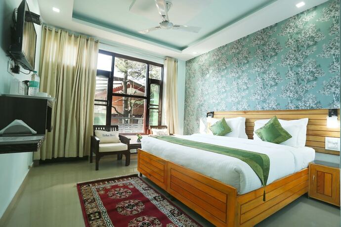 Imagen de la habitación del Hotel Treebo Trend Roshan House. Foto 16