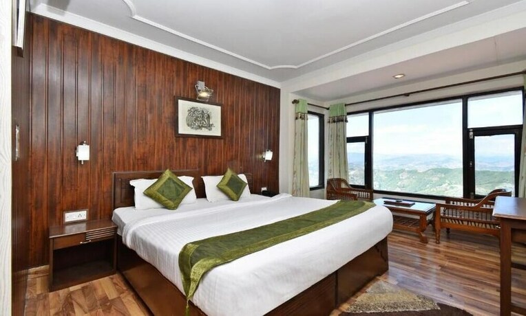 Imagen de la habitación del Hotel Treebo Trend Snow View Resort. Foto 2