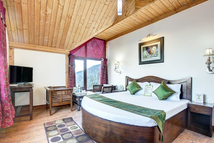 Imagen de la habitación del Hotel Treebo Trend Snow View Resort. Foto 3