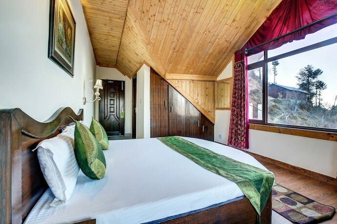Imagen de la habitación del Hotel Treebo Trend Snow View Resort. Foto 4