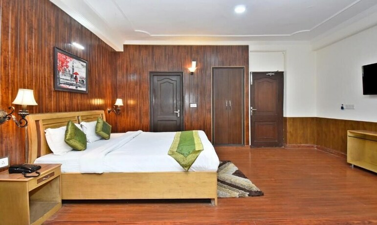 Imagen de la habitación del Hotel Treebo Trend Snow View Resort. Foto 6