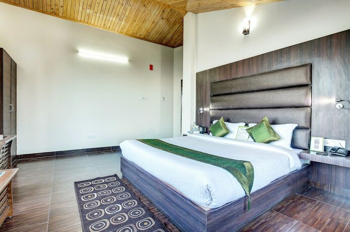 Imagen de la habitación del Hotel Treebo Trend Snow View Resort. Foto 7