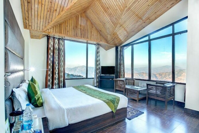 Imagen de la habitación del Hotel Treebo Trend Snow View Resort. Foto 9