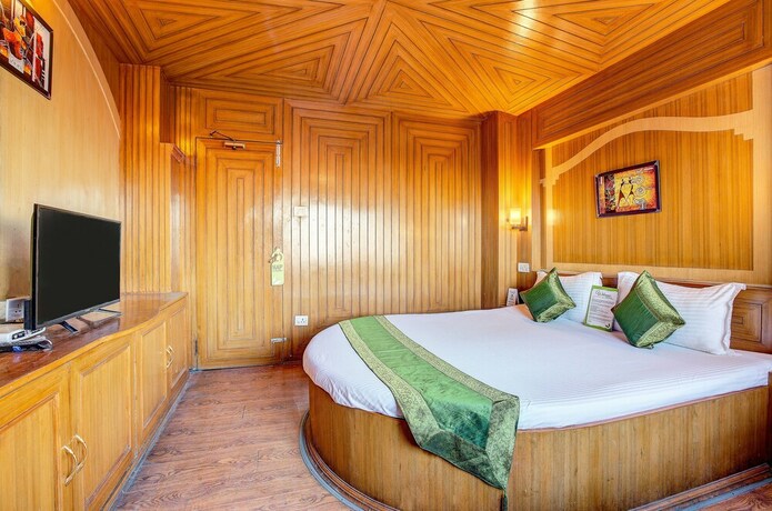 Imagen de la habitación del Hotel Treebo Trend Snow View Resort. Foto 10