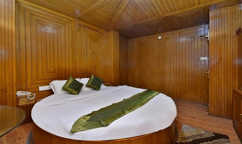 Imagen de la habitación del Hotel Treebo Trend Snow View Resort. Foto 11