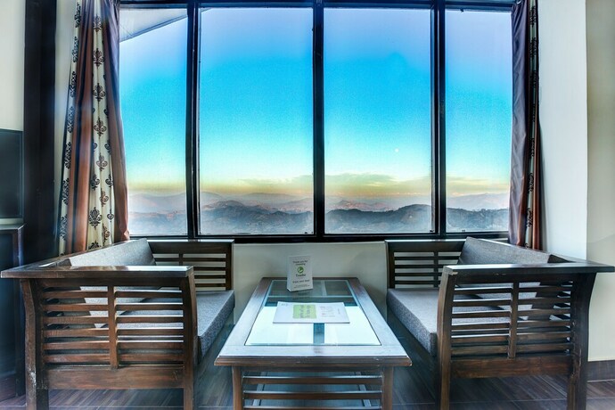 Imagen de la habitación del Hotel Treebo Trend Snow View Resort. Foto 12