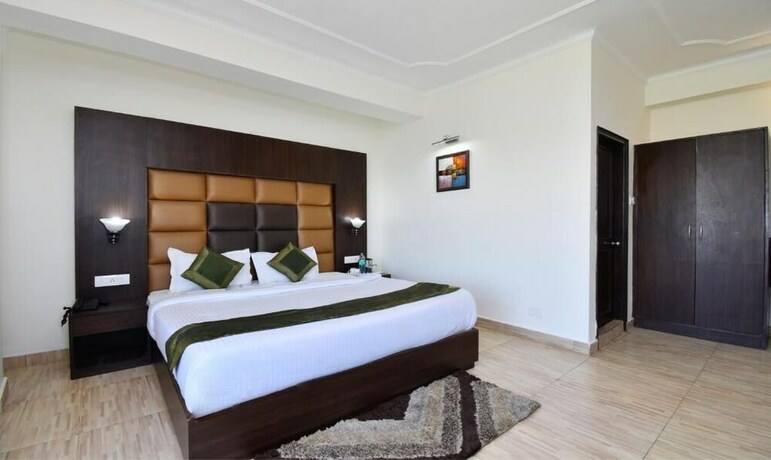 Imagen de la habitación del Hotel Treebo Trend Snow View Resort. Foto 13