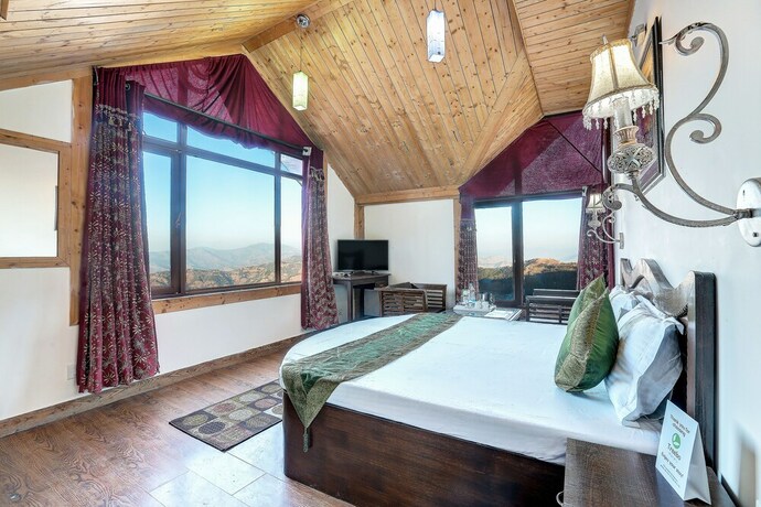 Imagen de la habitación del Hotel Treebo Trend Snow View Resort. Foto 16