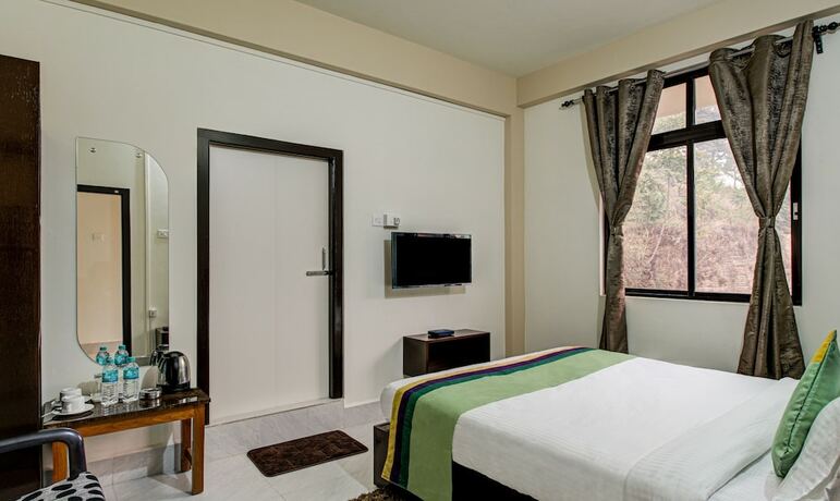 Imagen de la habitación del Hotel Treebo Trend Staying Center. Foto 20