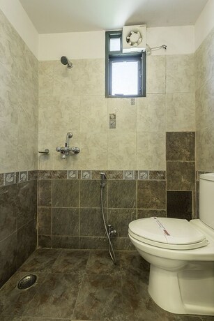 Imagen de la habitación del Hotel Treebo Trend Woodsvilla Suites. Foto 2