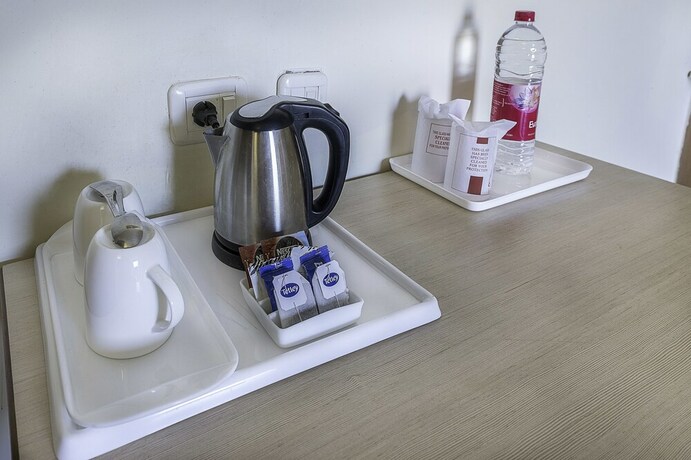Imagen de la habitación del Hotel Treebo Trend Woodsvilla Suites. Foto 4
