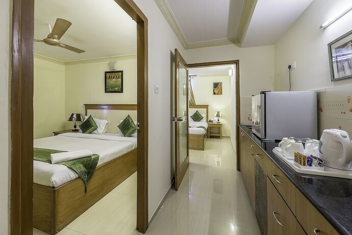 Imagen de la habitación del Hotel Treebo Trend Woodsvilla Suites. Foto 8
