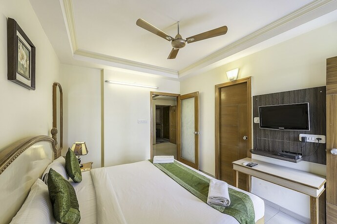 Imagen de la habitación del Hotel Treebo Trend Woodsvilla Suites. Foto 9