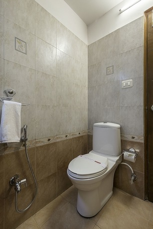 Imagen de la habitación del Hotel Treebo Trend Woodsvilla Suites. Foto 11