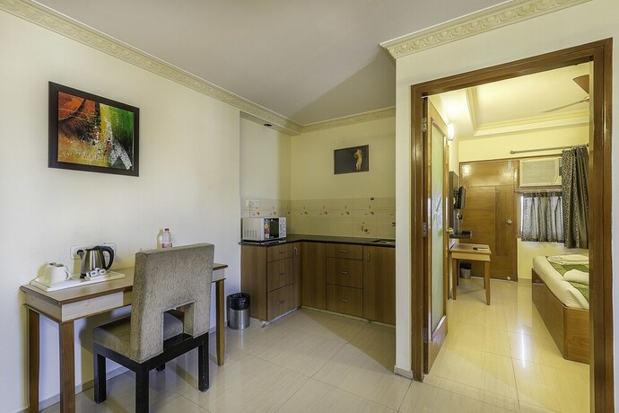 Imagen de la habitación del Hotel Treebo Trend Woodsvilla Suites. Foto 17